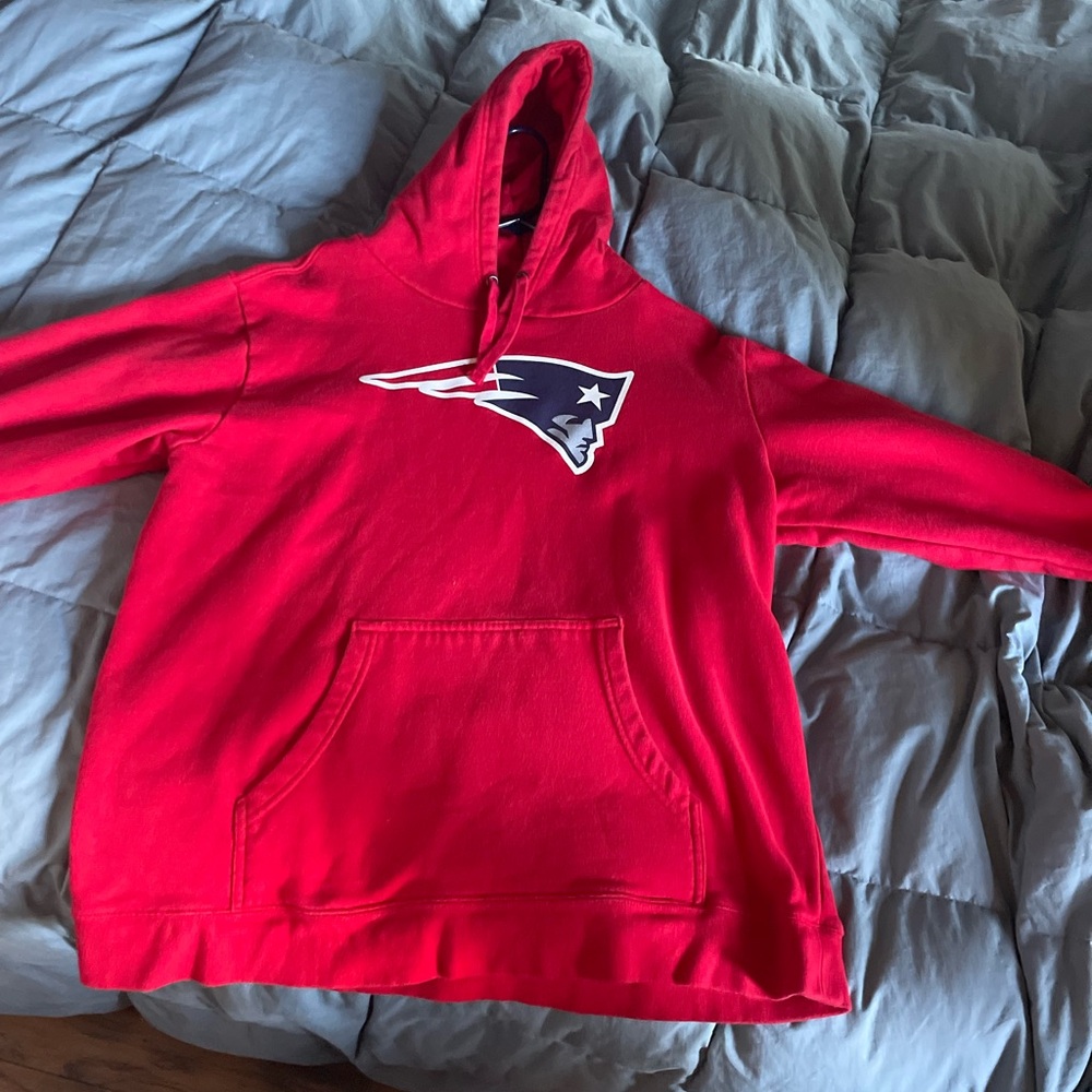 This is a red New England Patriots pullover hoodie